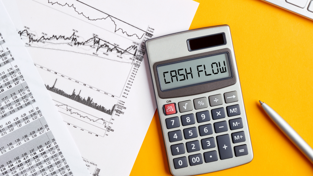 Image of a calculator with the words cash flow.